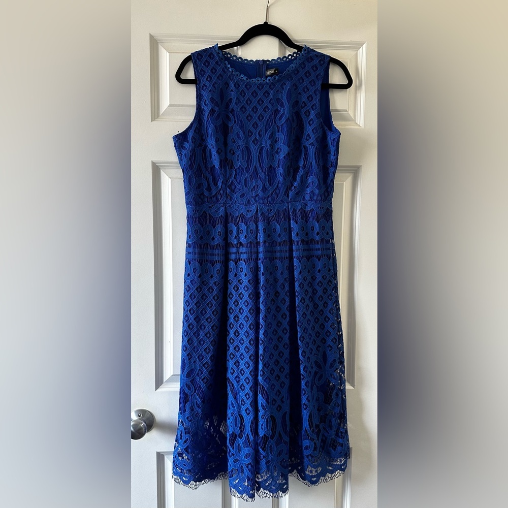 Ladies large sleeveless bright blue lace dress.    Zip up back. Knee length.